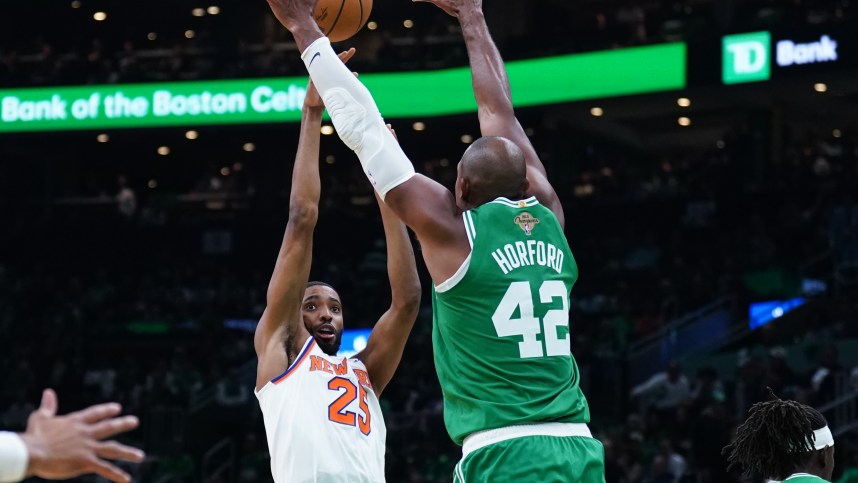 Oct 22, 2024; Boston, Massachusetts, USA; New York Knicks forward Mikal Bridges (25) shoots against Boston Celtics center Al Horford (42) in the second half at TD Garden. Mandatory Credit: David Butler II-Imagn Images