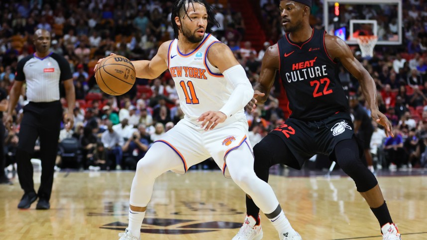 Apr 2, 2024; Miami, Florida, USA; New York Knicks guard Jalen Brunson (11) dribbles the basketball as Miami Heat forward Jimmy Butler (22) defends during the first quarter at Kaseya Center. Mandatory Credit: Sam Navarro-Imagn Images