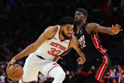 Oct 30, 2024; Miami, Florida, USA; New York Knicks center Karl-Anthony Towns (32) drives to the basketball against Miami Heat forward Jimmy Butler (22) during the fourth quarter at Kaseya Center. Mandatory Credit: Sam Navarro-Imagn Images