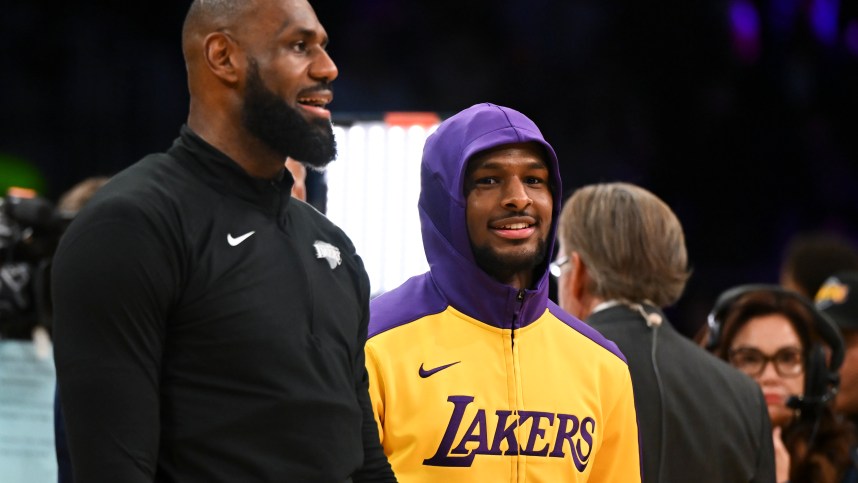 Oct 25, 2024; Los Angeles, California, USA; Los Angeles Lakers guard Bronny James (9) and forward LeBron James (23) warming up before the game against the Phoenix Suns at Crypto.com Arena. Mandatory Credit: Jonathan Hui-Imagn Images