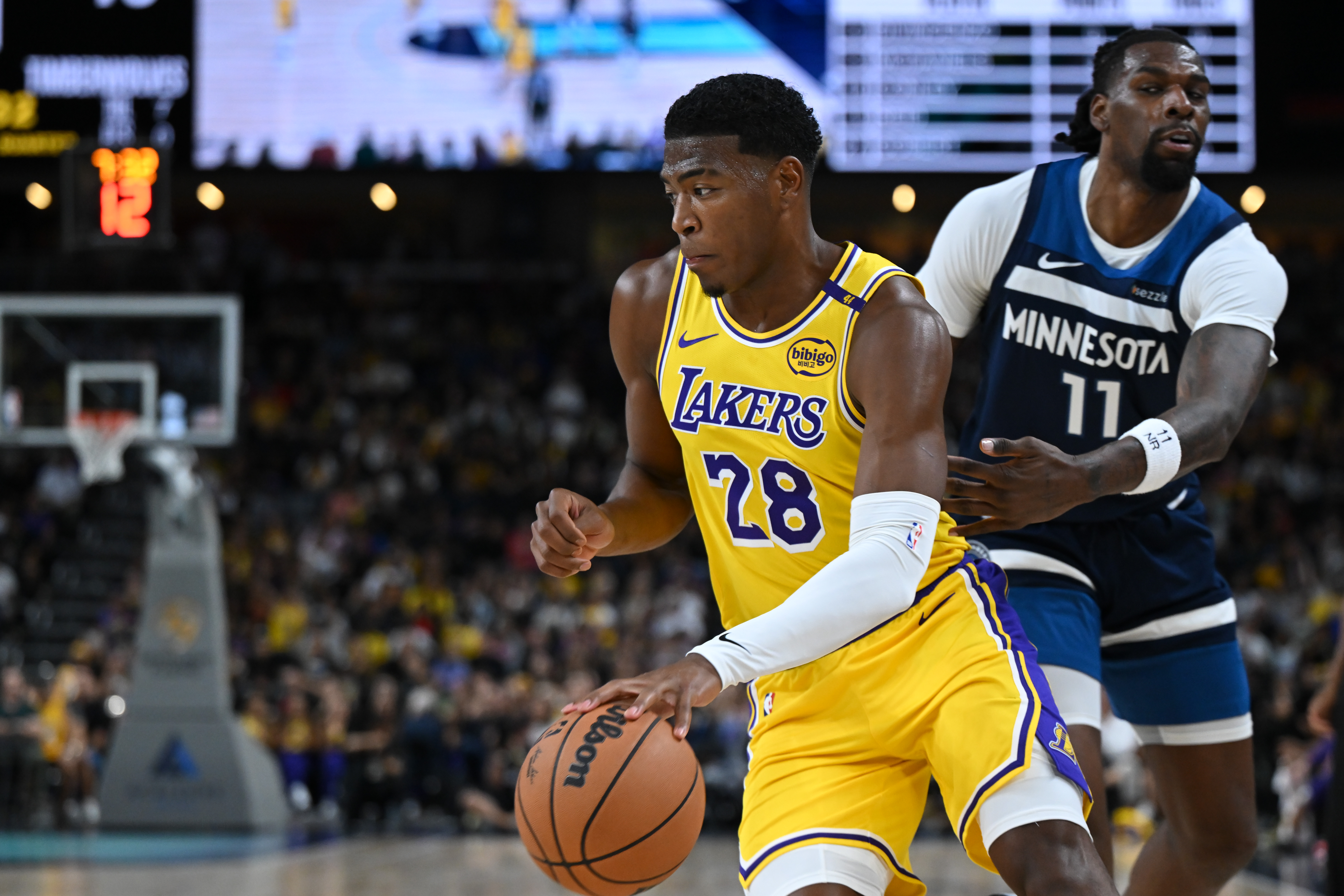 Oct 4, 2024; Palm Desert, California, USA; Los Angeles Lakers forward Rui Hachimura (28) moves the ball against Minnesota Timberwolves center Naz Reid (11) during the first half at Acrisure Arena. Mandatory Credit: Jonathan Hui-Imagn Images