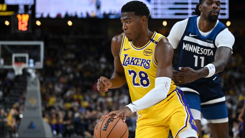 Oct 4, 2024; Palm Desert, California, USA; Los Angeles Lakers forward Rui Hachimura (28) moves the ball against Minnesota Timberwolves center Naz Reid (11) during the first half at Acrisure Arena. Mandatory Credit: Jonathan Hui-Imagn Images