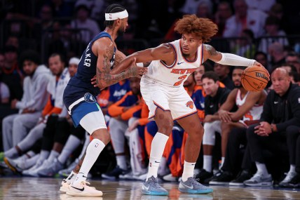 Oct 13, 2024; New York, New York, USA; New York Knicks guard Miles McBride (2) is defended by Minnesota Timberwolves guard Nickeil Alexander-Walker (9) during the second half at Madison Square Garden. Mandatory Credit: Vincent Carchietta-Imagn Images