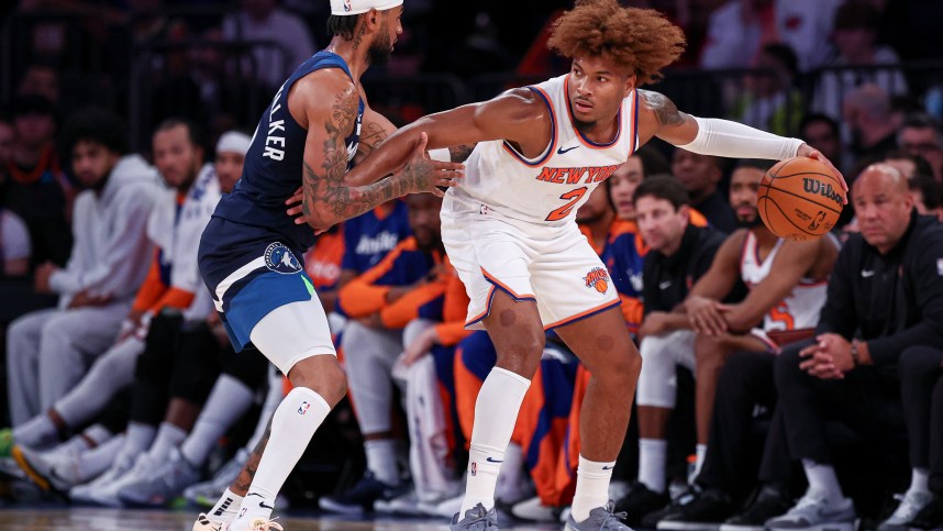 Oct 13, 2024; New York, New York, USA; New York Knicks guard Miles McBride (2) is defended by Minnesota Timberwolves guard Nickeil Alexander-Walker (9) during the second half at Madison Square Garden. Mandatory Credit: Vincent Carchietta-Imagn Images