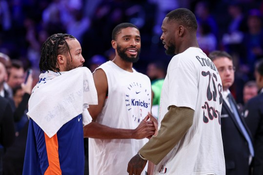 Oct 13, 2024; New York, New York, USA; New York Knicks guard Jalen Brunson, left, and forward Mikal Bridges, center, talk with Minnesota Timberwolves forward Julius Randle, right, after the game at Madison Square Garden. Mandatory Credit: Vincent Carchietta-Imagn Images