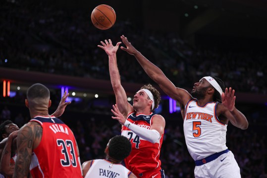 Oct 9, 2024; New York, New York, USA; Washington Wizards forward Corey Kispert (24) shoots the ball as New York Knicks forward Precious Achiuwa (5) defends during the first half at Madison Square Garden. Mandatory Credit: Vincent Carchietta-Imagn Images