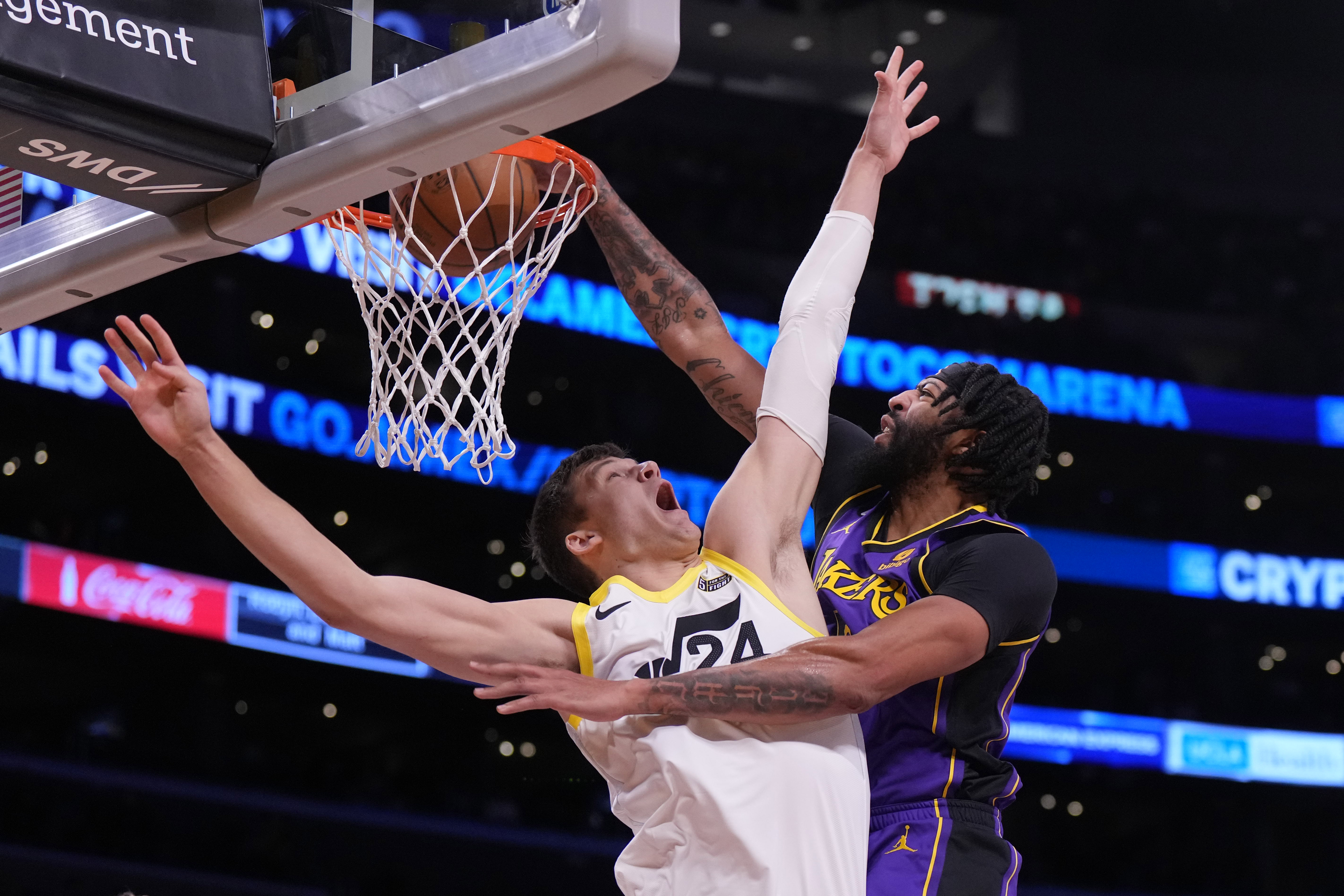 Nov 4, 2022; Los Angeles, California, USA; Los Angeles Lakers forward Anthony Davis (3) dunks the ball against Utah Jazz center Walker Kessler (24) in the first half at Crypto.com Arena. Mandatory Credit: Kirby Lee-Imagn Images