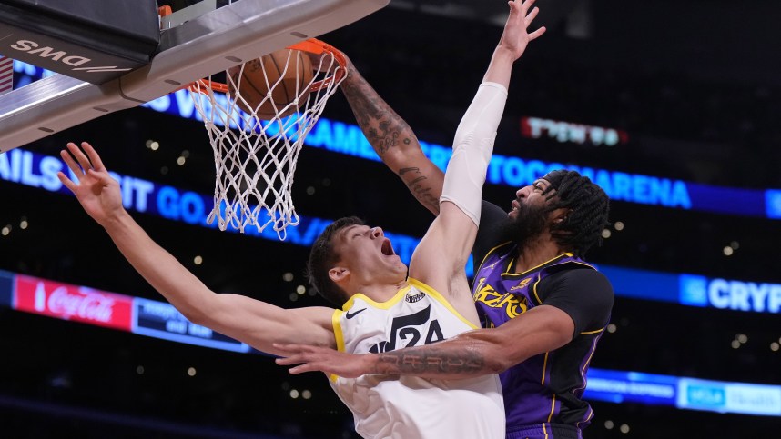 Nov 4, 2022; Los Angeles, California, USA; Los Angeles Lakers forward Anthony Davis (3) dunks the ball against Utah Jazz center Walker Kessler (24) in the first half at Crypto.com Arena. Mandatory Credit: Kirby Lee-Imagn Images