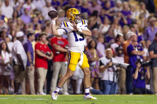 Oct 12, 2024; Baton Rouge, Louisiana, USA;  LSU Tigers quarterback Garrett Nussmeier (13) throws against the Mississippi Rebels during the first half at Tiger Stadium. Mandatory Credit: Stephen Lew-Imagn Images