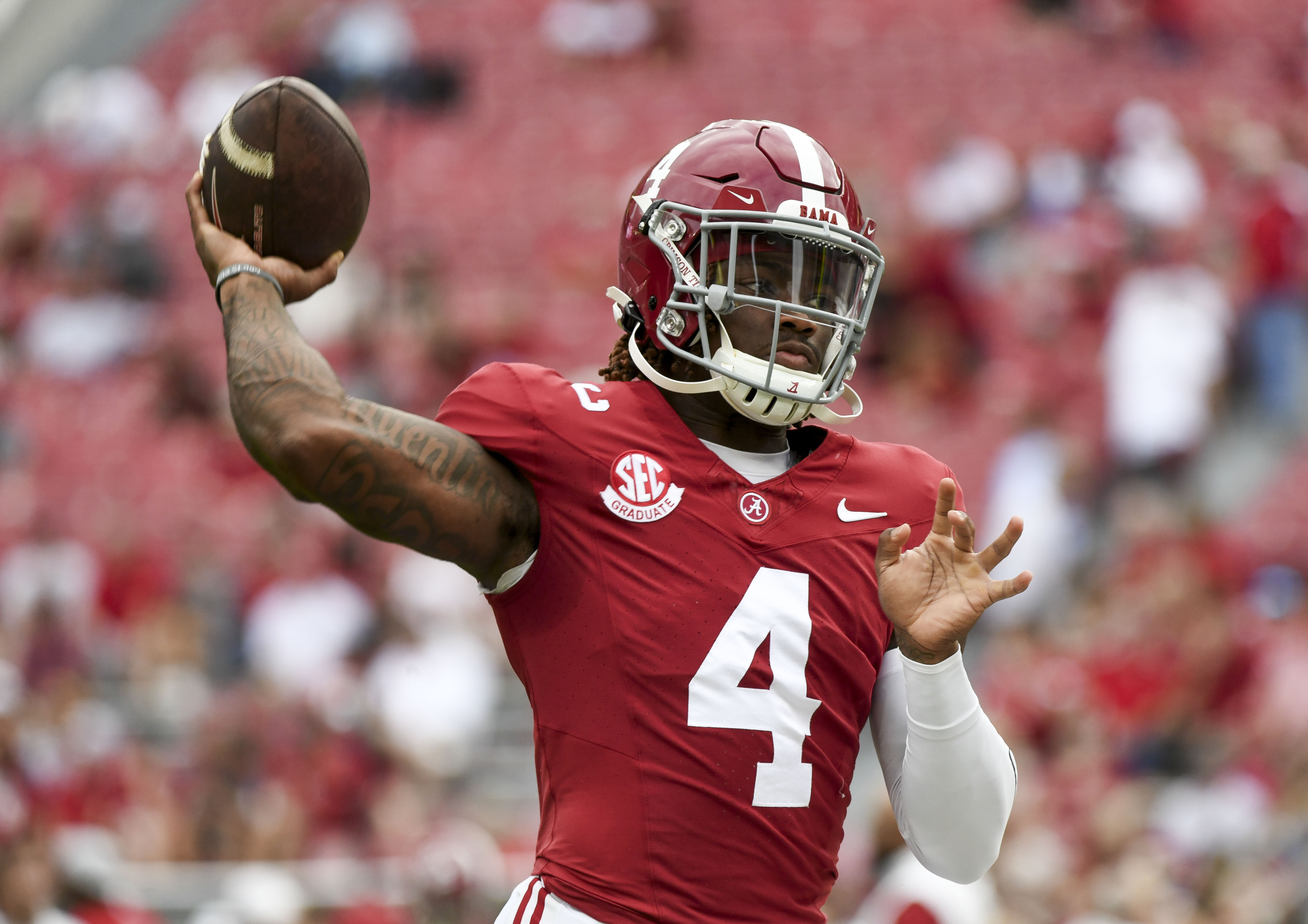 Sep 7, 2024; Tuscaloosa, Alabama, USA; Alabama Crimson Tide quarterback Jalen Milroe (4)(New York Giants prospect) throws during pregame warmups before a game against the South Florida Bulls at Bryant-Denny Stadium. Mandatory Credit: Gary Cosby Jr.-Imagn Images