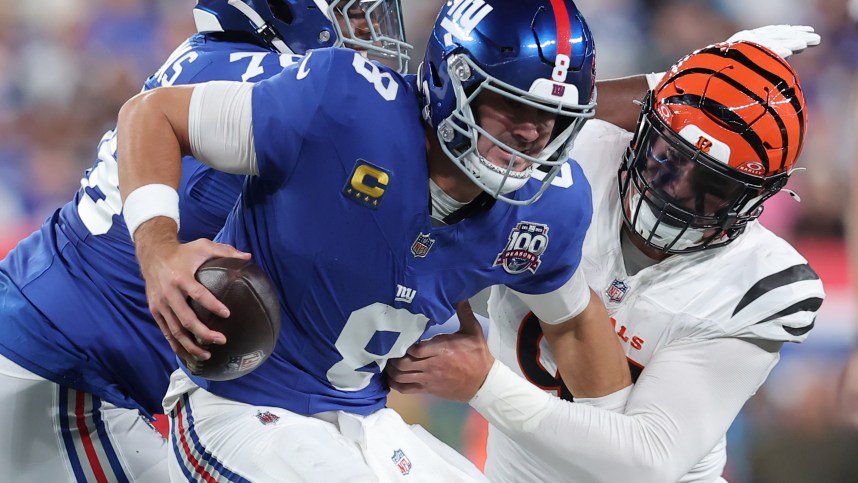 Oct 13, 2024; East Rutherford, New Jersey, USA; Cincinnati Bengals defensive end Trey Hendrickson (91) sacks New York Giants quarterback Daniel Jones (8) during the second quarter at MetLife Stadium. Mandatory Credit: Brad Penner-Imagn Images