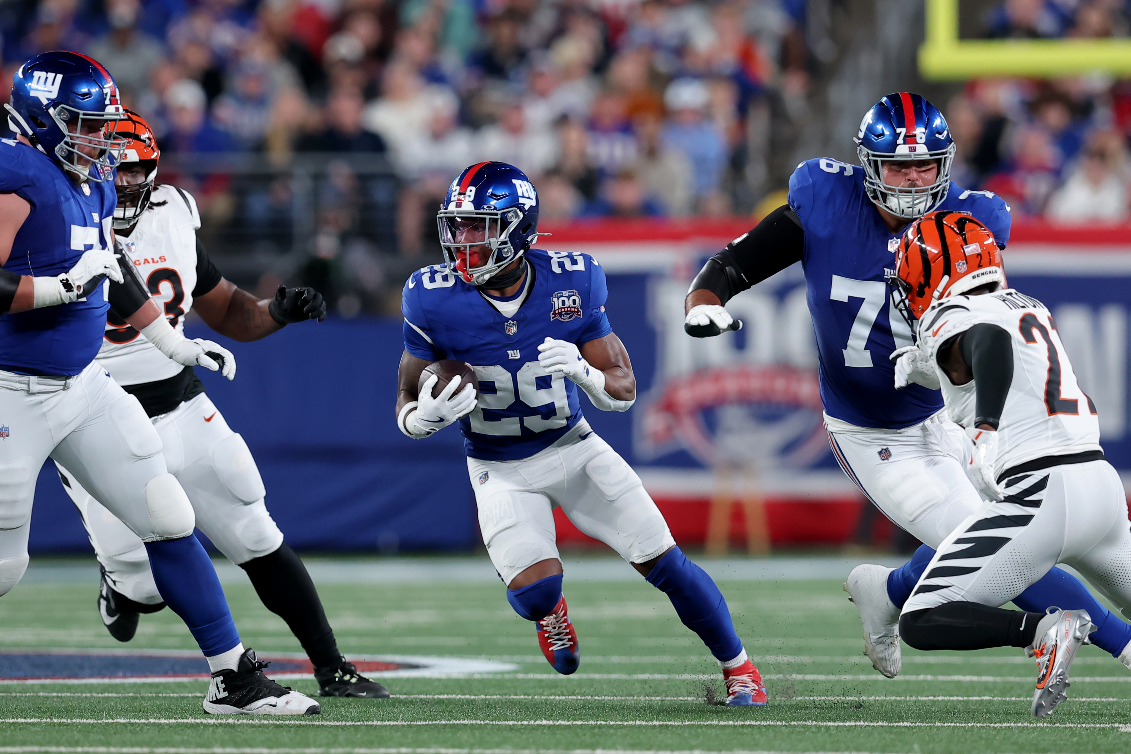 Oct 13, 2024; East Rutherford, New Jersey, USA; New York Giants running back Tyrone Tracy Jr. (29) runs with the ball against the Cincinnati Bengals during the first quarter at MetLife Stadium. Mandatory Credit: Brad Penner-Imagn Images