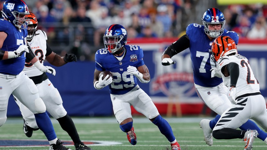 Oct 13, 2024; East Rutherford, New Jersey, USA; New York Giants running back Tyrone Tracy Jr. (29) runs with the ball against the Cincinnati Bengals during the first quarter at MetLife Stadium. Mandatory Credit: Brad Penner-Imagn Images