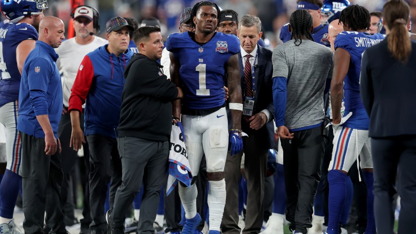 Sep 26, 2024; East Rutherford, New Jersey, USA; New York Giants wide receiver Malik Nabers (1) is helped off the field after an injury during the fourth quarter against the Dallas Cowboys at MetLife Stadium. Mandatory Credit: Brad Penner-Imagn Images