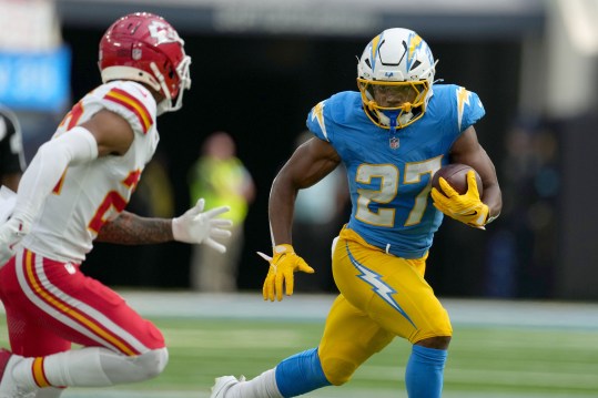 Sep 29, 2024; Inglewood, California, USA; Los Angeles Chargers running back J.K. Dobbins (27) carries the ball in the first quarter against the Kansas City Chiefs at SoFi Stadium. Mandatory Credit: Kirby Lee-Imagn Images