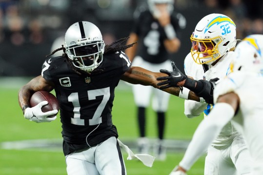 Dec 14, 2023; Paradise, Nevada, USA; Las Vegas Raiders wide receiver Davante Adams (17) runs against Los Angeles Chargers safety Alohi Gilman (32) in the first quarter at Allegiant Stadium. Mandatory Credit: Stephen R. Sylvanie-Imagn Images