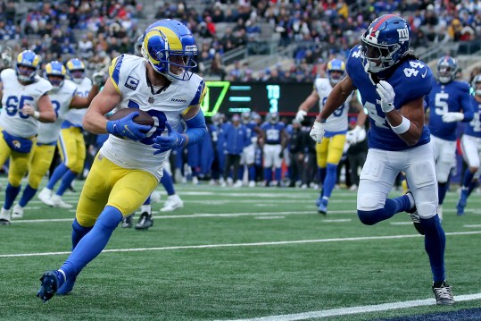 Dec 31, 2023; East Rutherford, New Jersey, USA; Los Angeles Rams wide receiver Cooper Kupp (10) catches a touchdown pass against New York Giants cornerback Nick McCloud (44) during the second quarter at MetLife Stadium. Mandatory Credit: Brad Penner-Imagn Images