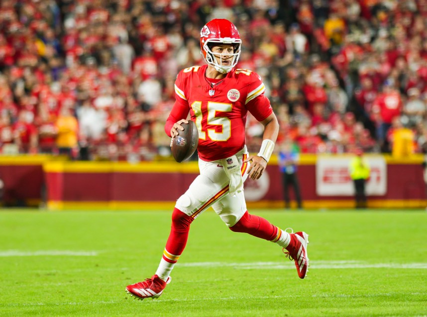 Oct 7, 2024; Kansas City, Missouri, USA; Kansas City Chiefs quarterback Patrick Mahomes (15) rolls out to pass during the first half against the New Orleans Saints at GEHA Field at Arrowhead Stadium. Mandatory Credit: Jay Biggerstaff-Imagn Images