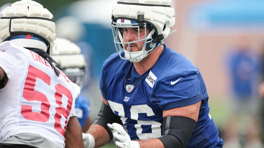 Jul 24, 2024; East Rutherford, NJ, USA; New York Giants guard Jon Runyan (76) blocks linebacker Bobby Okereke (58) during training camp at Quest Diagnostics Training Facility. Mandatory Credit: Vincent Carchietta-Imagn Images