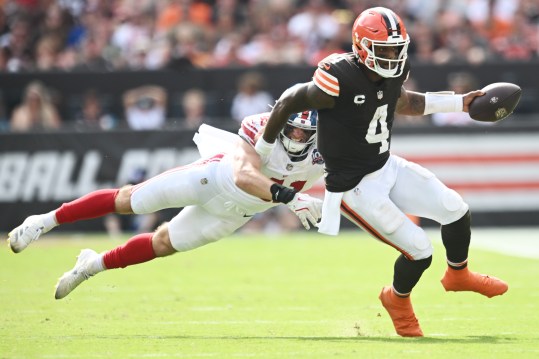 Sep 22, 2024; Cleveland, Ohio, USA; Cleveland Browns quarterback Deshaun Watson (4) scrambles from New York Giants linebacker Micah McFadden (41) during the second half at Huntington Bank Field. Mandatory Credit: Ken Blaze-Imagn Images