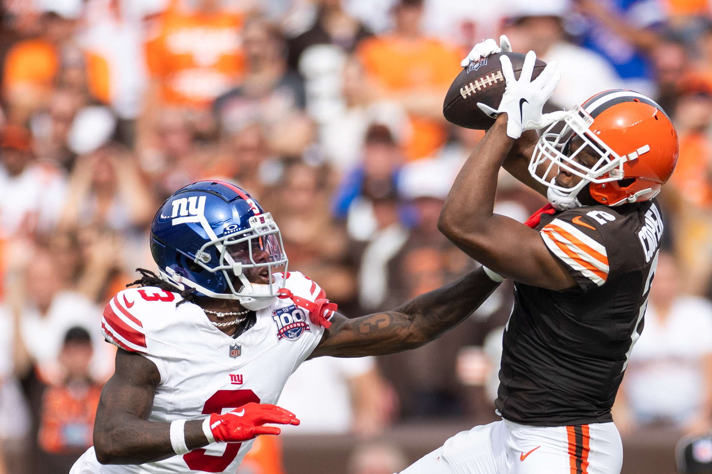 Sep 22, 2024; Cleveland, Ohio, USA; Cleveland Browns wide receiver Amari Cooper (2) catches the ball under coverage by New York Giants cornerback Deonte Banks (3) during the fourth quarter at Huntington Bank Field. Mandatory Credit: Scott Galvin-Imagn Images