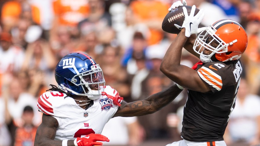 Sep 22, 2024; Cleveland, Ohio, USA; Cleveland Browns wide receiver Amari Cooper (2) catches the ball under coverage by New York Giants cornerback Deonte Banks (3) during the fourth quarter at Huntington Bank Field. Mandatory Credit: Scott Galvin-Imagn Images