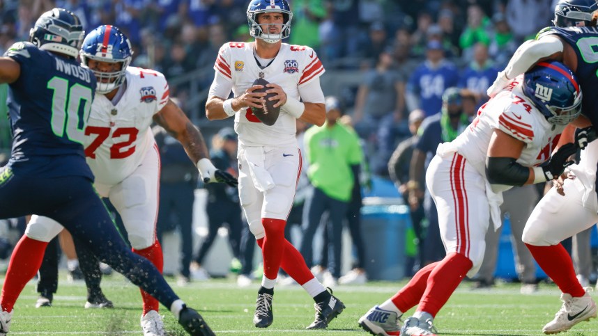 Oct 6, 2024; Seattle, Washington, USA; New York Giants quarterback Daniel Jones (8) looks to pass against the Seattle Seahawks during the first quarter at Lumen Field. Mandatory Credit: Joe Nicholson-Imagn Images