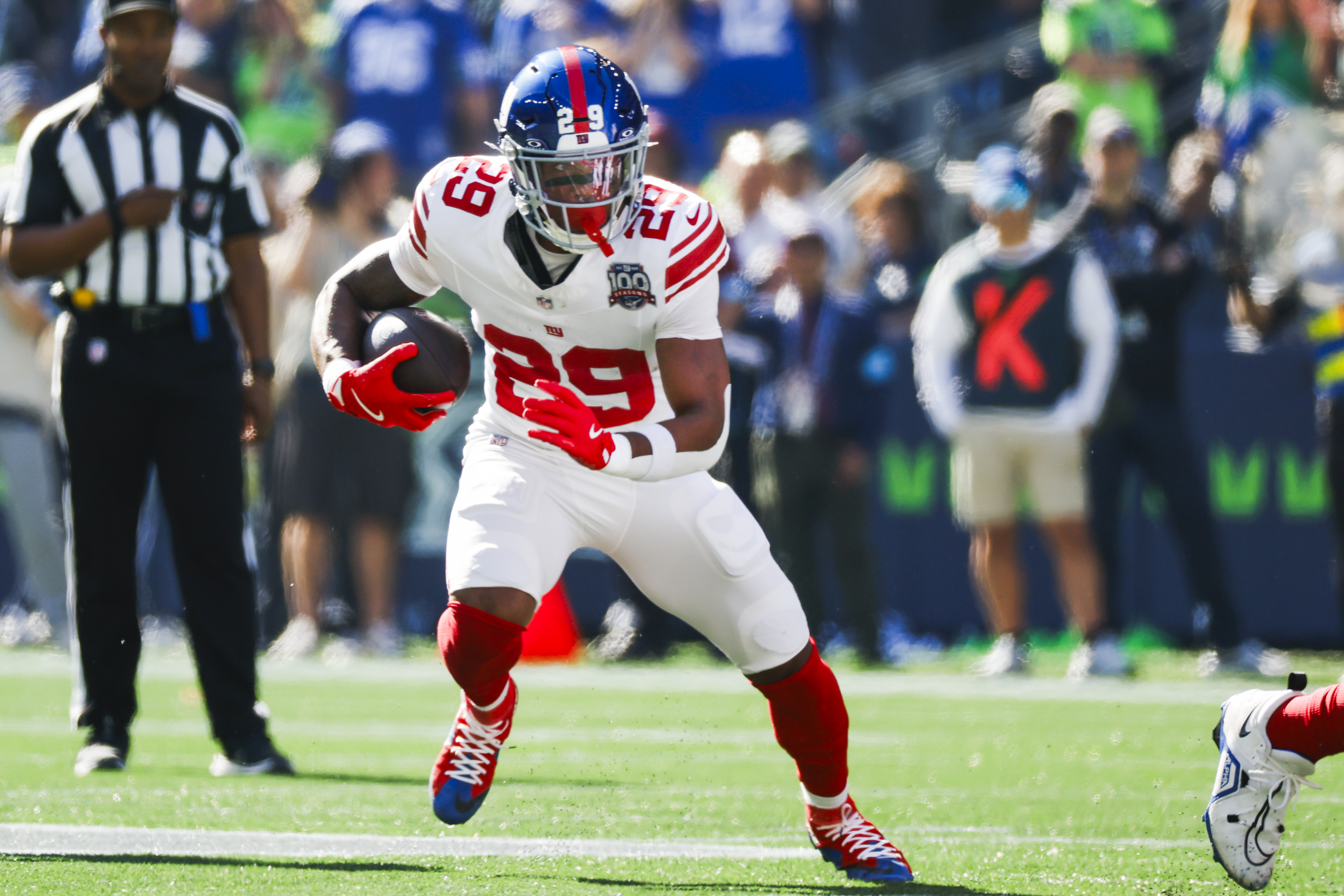 Oct 6, 2024; Seattle, Washington, USA; New York Giants running back Tyrone Tracy Jr. (29) rushes against the Seattle Seahawks during the first quarter at Lumen Field. Mandatory Credit: Joe Nicholson-Imagn Images