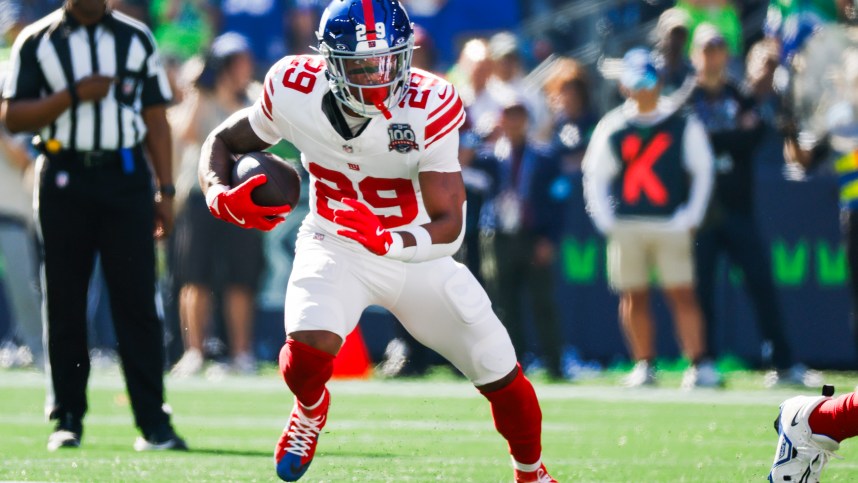 Oct 6, 2024; Seattle, Washington, USA; New York Giants running back Tyrone Tracy Jr. (29) rushes against the Seattle Seahawks during the first quarter at Lumen Field. Mandatory Credit: Joe Nicholson-Imagn Images