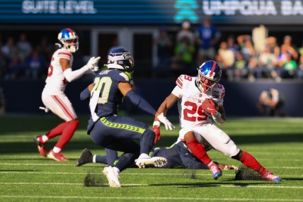 Oct 6, 2024; Seattle, Washington, USA; New York Giants running back Tyrone Tracy Jr. (29) carries the ball against the Seattle Seahawks during the second half at Lumen Field. Mandatory Credit: Steven Bisig-Imagn Images