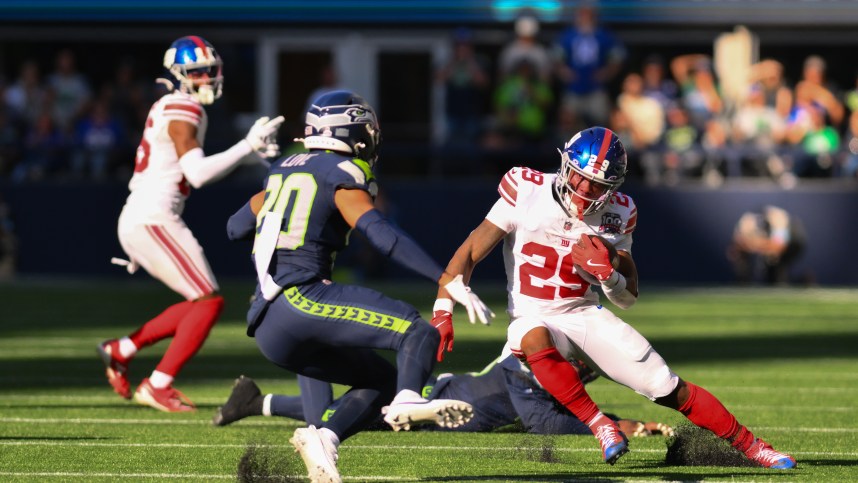 Oct 6, 2024; Seattle, Washington, USA; New York Giants running back Tyrone Tracy Jr. (29) carries the ball against the Seattle Seahawks during the second half at Lumen Field. Mandatory Credit: Steven Bisig-Imagn Images