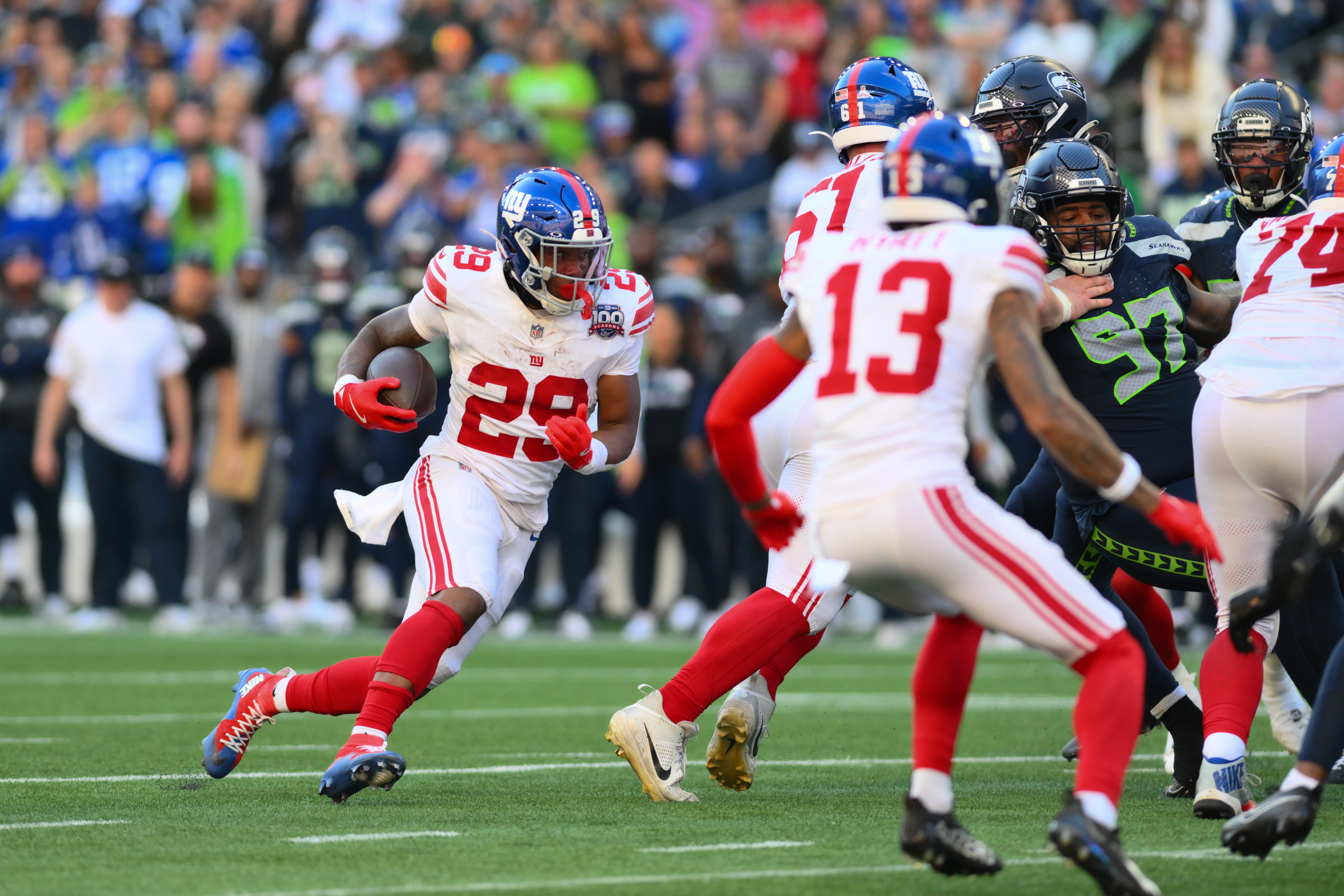 Oct 6, 2024; Seattle, Washington, USA; New York Giants running back Tyrone Tracy Jr. (29) carries the ball against the Seattle Seahawks during the second half at Lumen Field. Mandatory Credit: Steven Bisig-Imagn Images