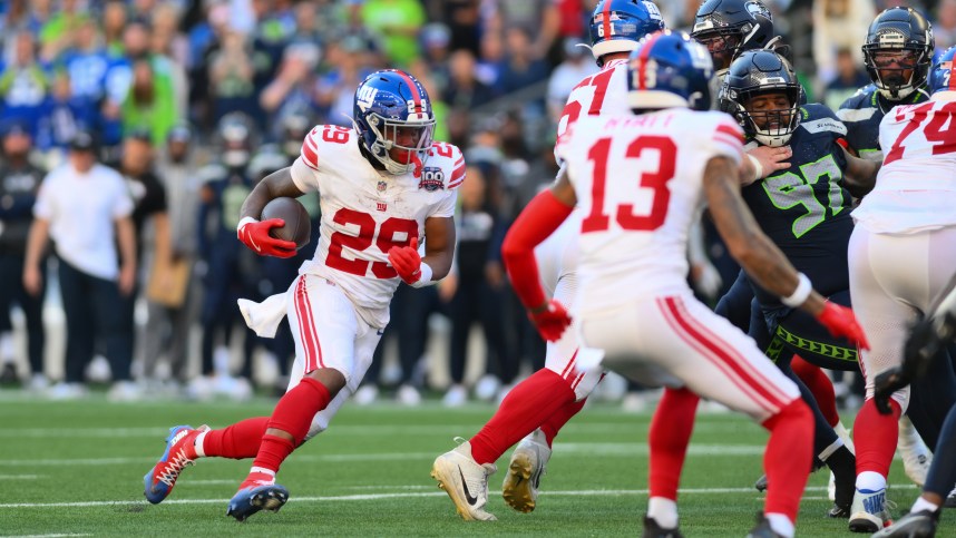 Oct 6, 2024; Seattle, Washington, USA; New York Giants running back Tyrone Tracy Jr. (29) carries the ball against the Seattle Seahawks during the second half at Lumen Field. Mandatory Credit: Steven Bisig-Imagn Images