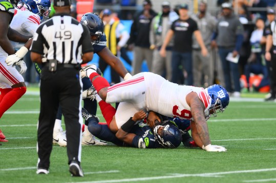 Oct 6, 2024; Seattle, Washington, USA; New York Giants defensive tackle Dexter Lawrence II (97) sacks Seattle Seahawks quarterback Geno Smith (7) during the second half at Lumen Field. Mandatory Credit: Steven Bisig-Imagn Images