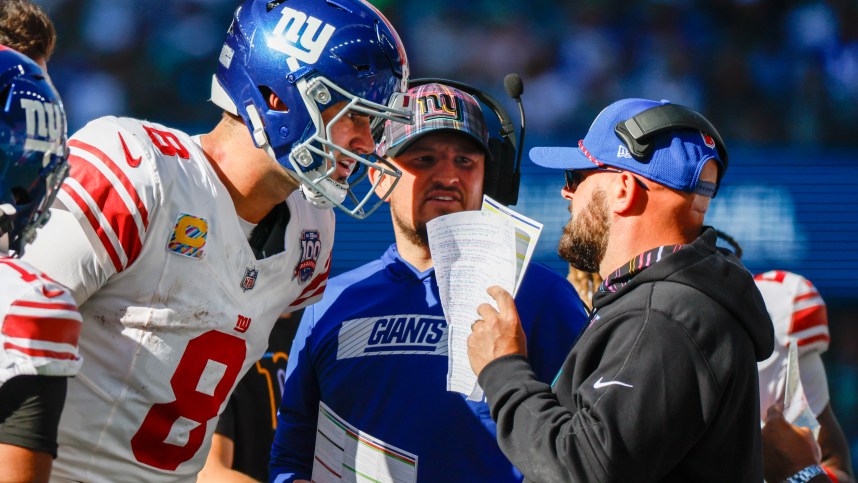 Oct 6, 2024; Seattle, Washington, USA; New York Giants quarterback Daniel Jones (8) talks with head coach Brian Daboll, right) during the second quarter against the Seattle Seahawks at Lumen Field. New York Giants quarterbacks coach Shea Tierney stands in the middle. Mandatory Credit: Joe Nicholson-Imagn Images