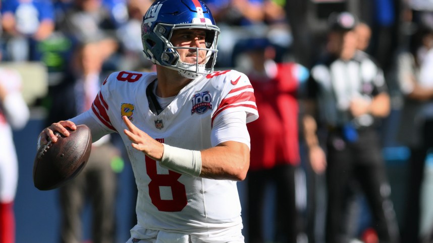 Oct 6, 2024; Seattle, Washington, USA; New York Giants quarterback Daniel Jones (8) passes the ball against the Seattle Seahawks at Lumen Field. Mandatory Credit: Steven Bisig-Imagn Images