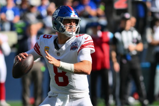 Oct 6, 2024; Seattle, Washington, USA; New York Giants quarterback Daniel Jones (8) passes the ball against the Seattle Seahawks at Lumen Field. Mandatory Credit: Steven Bisig-Imagn Images