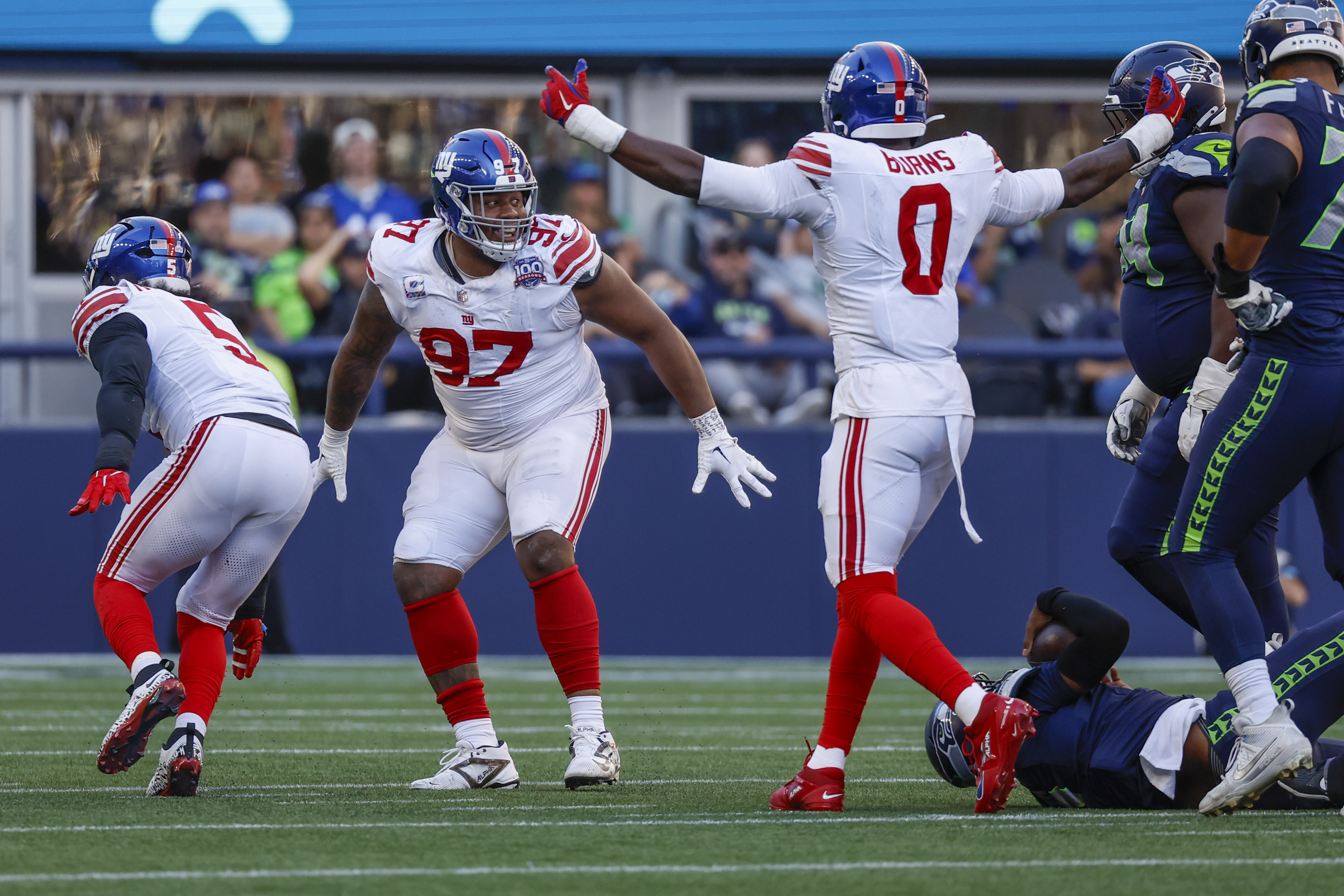 Oct 6, 2024; Seattle, Washington, USA; New York Giants defensive tackle Dexter Lawrence II (97) celebrates following a fourth down sack against the Seattle Seahawks during the fourth quarter at Lumen Field. Mandatory Credit: Joe Nicholson-Imagn Images