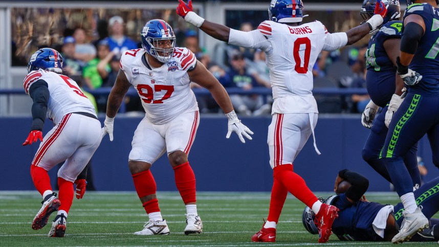 Oct 6, 2024; Seattle, Washington, USA; New York Giants defensive tackle Dexter Lawrence II (97) celebrates following a fourth down sack against the Seattle Seahawks during the fourth quarter at Lumen Field. Mandatory Credit: Joe Nicholson-Imagn Images