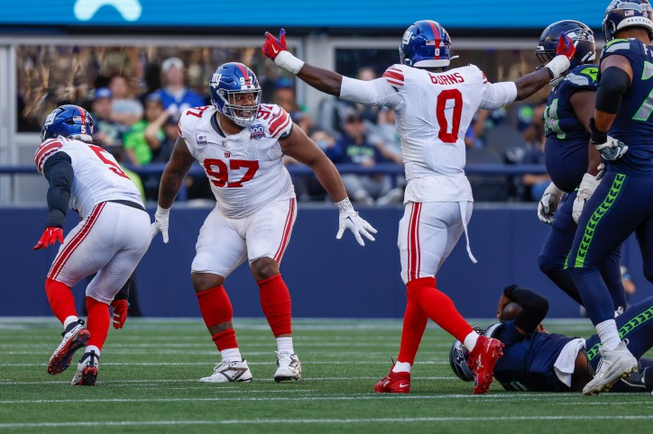 Oct 6, 2024; Seattle, Washington, USA; New York Giants defensive tackle Dexter Lawrence II (97) celebrates following a fourth down sack against the Seattle Seahawks during the fourth quarter at Lumen Field. Mandatory Credit: Joe Nicholson-Imagn Images