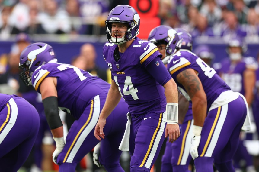 Oct 6, 2024; Tottenham, ENG; Minnesota Vikings Quarterback Sam Darnold (14) calls out a play in the 1st Quarter against New York Jets at Tottenham Hotspur Stadium. Mandatory Credit: Shaun Brooks-Imagn Images