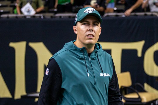 Sep 22, 2024; New Orleans, Louisiana, USA; Philadelphia Eagles offensive coordinator Kellen Moore looks on during warmups before the game against the New Orleans Saints at Caesars Superdome. Mandatory Credit: Stephen Lew-Imagn Images