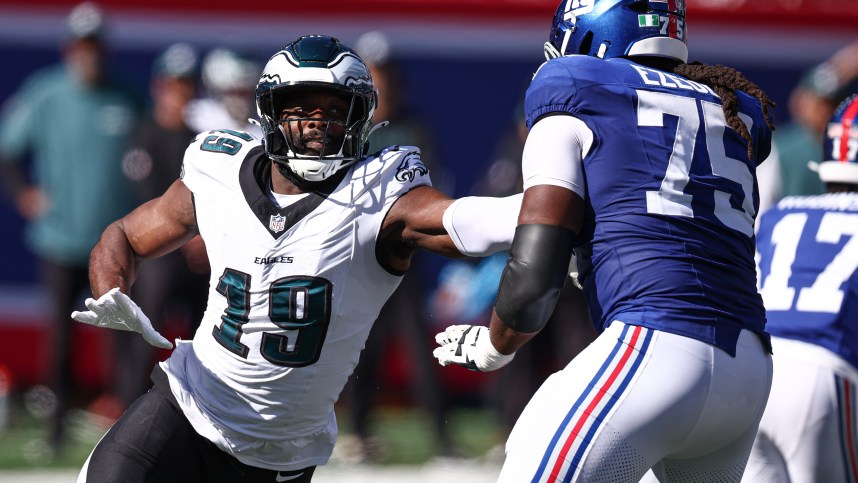 Oct 20, 2024; East Rutherford, New Jersey, USA; Philadelphia Eagles linebacker Josh Sweat (19) pass rushes against the New York Giants New York Giants guard Joshua Ezeudu (75) during the first half at MetLife Stadium. Mandatory Credit: Vincent Carchietta-Imagn Images