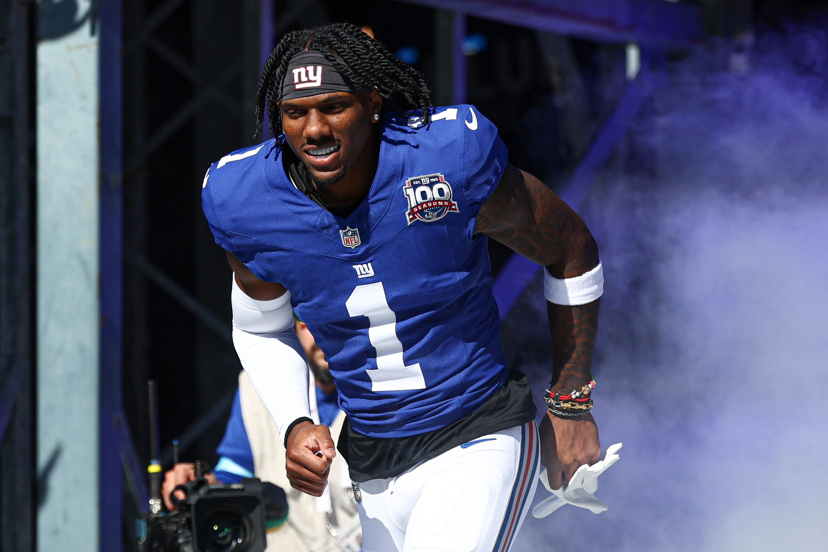 Oct 20, 2024; East Rutherford, New Jersey, USA; New York Giants wide receiver Malik Nabers (1) enter the field during introductions before the game against the Philadelphia Eagles at MetLife Stadium. Mandatory Credit: Vincent Carchietta-Imagn Images