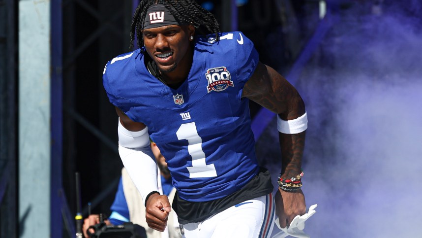 Oct 20, 2024; East Rutherford, New Jersey, USA; New York Giants wide receiver Malik Nabers (1) enter the field during introductions before the game against the Philadelphia Eagles at MetLife Stadium. Mandatory Credit: Vincent Carchietta-Imagn Images