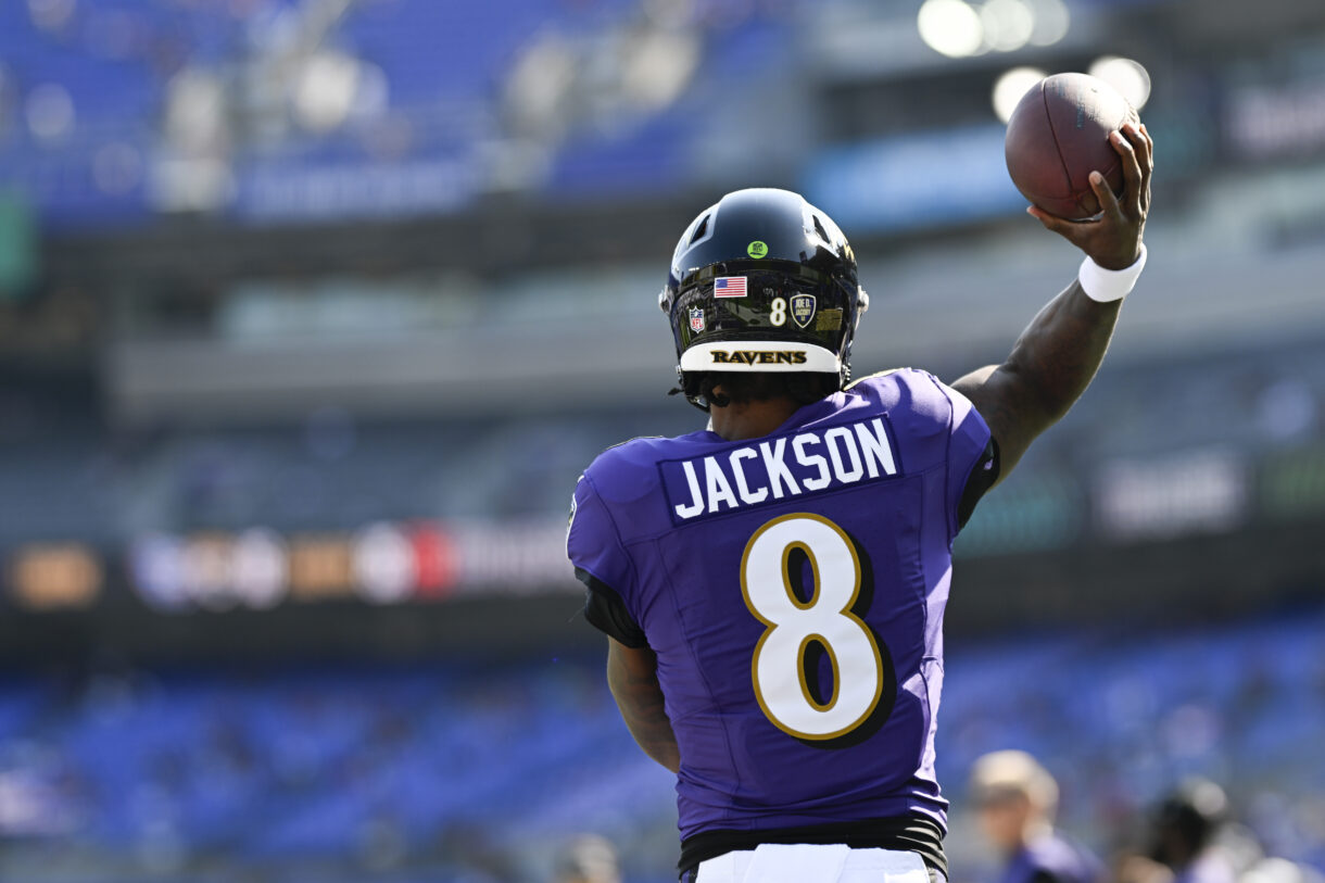 Oct 13, 2024; Baltimore, Maryland, USA;  Baltimore Ravens quarterback Lamar Jackson (8) throws before the game against the Washington Commanders at M&T Bank Stadium. Mandatory Credit: Tommy Gilligan-Imagn Images