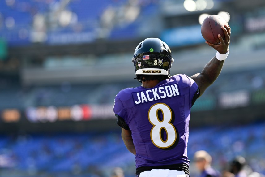 Oct 13, 2024; Baltimore, Maryland, USA;  Baltimore Ravens quarterback Lamar Jackson (8) throws before the game against the Washington Commanders at M&T Bank Stadium. Mandatory Credit: Tommy Gilligan-Imagn Images