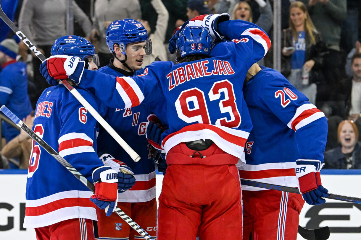 Oct 14, 2024; New York, New York, USA;  New York Rangers celebrate the goal by New York Rangers right wing Reilly Smith (91) against the Detroit Red Wings during the third period at Madison Square Garden. Mandatory Credit: Dennis Schneidler-Imagn Images