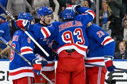 Oct 14, 2024; New York, New York, USA;  New York Rangers celebrate the goal by New York Rangers right wing Reilly Smith (91) against the Detroit Red Wings during the third period at Madison Square Garden. Mandatory Credit: Dennis Schneidler-Imagn Images