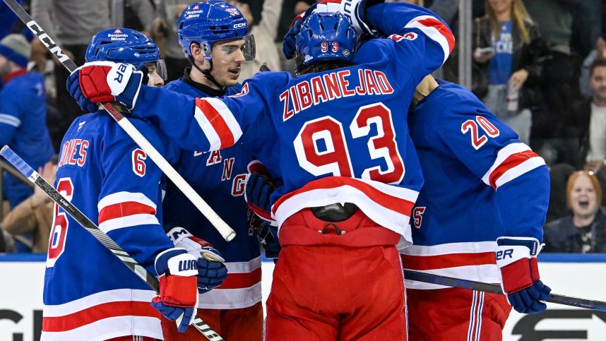 Oct 14, 2024; New York, New York, USA;  New York Rangers celebrate the goal by New York Rangers right wing Reilly Smith (91) against the Detroit Red Wings during the third period at Madison Square Garden. Mandatory Credit: Dennis Schneidler-Imagn Images